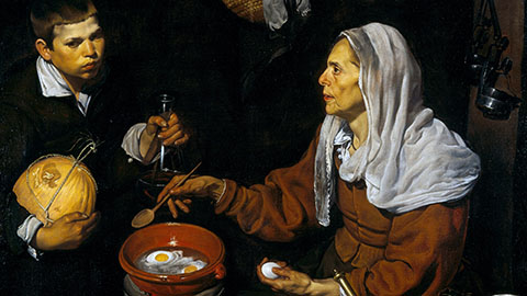 An Old Woman Cooking Eggs